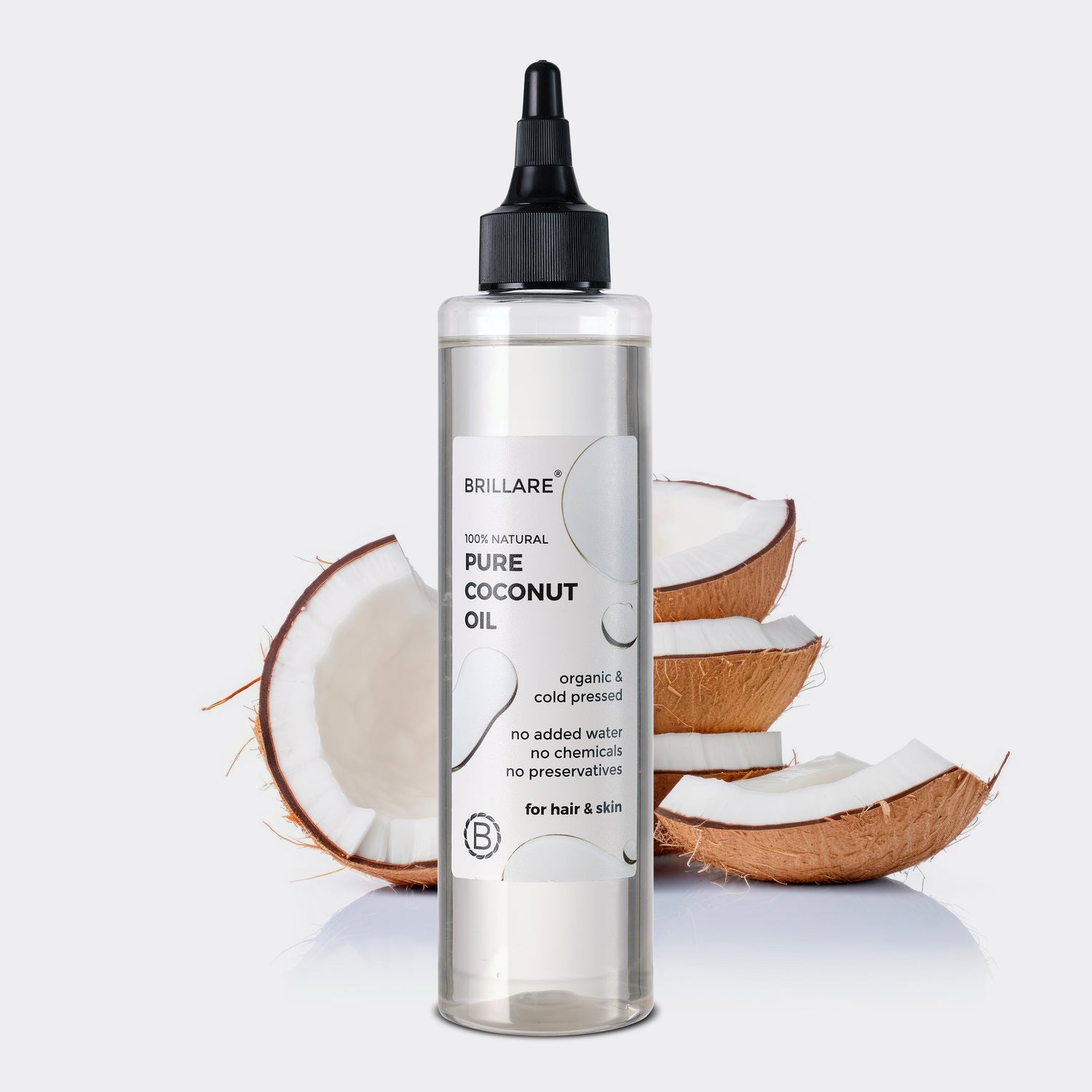 front view of Brillare Pure Coconut Oil against white background and coconut.